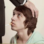 French Anti-Smoking Campaign Ad Picture with Young Man Giving Cigarette Blowjob to a Tobacco Exec
