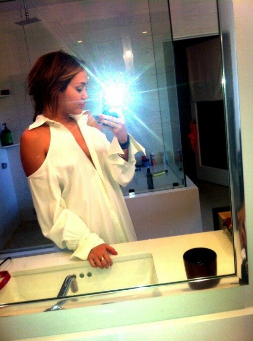 Miley Cyrus Cleavage Photo Self Shot in Bathroom